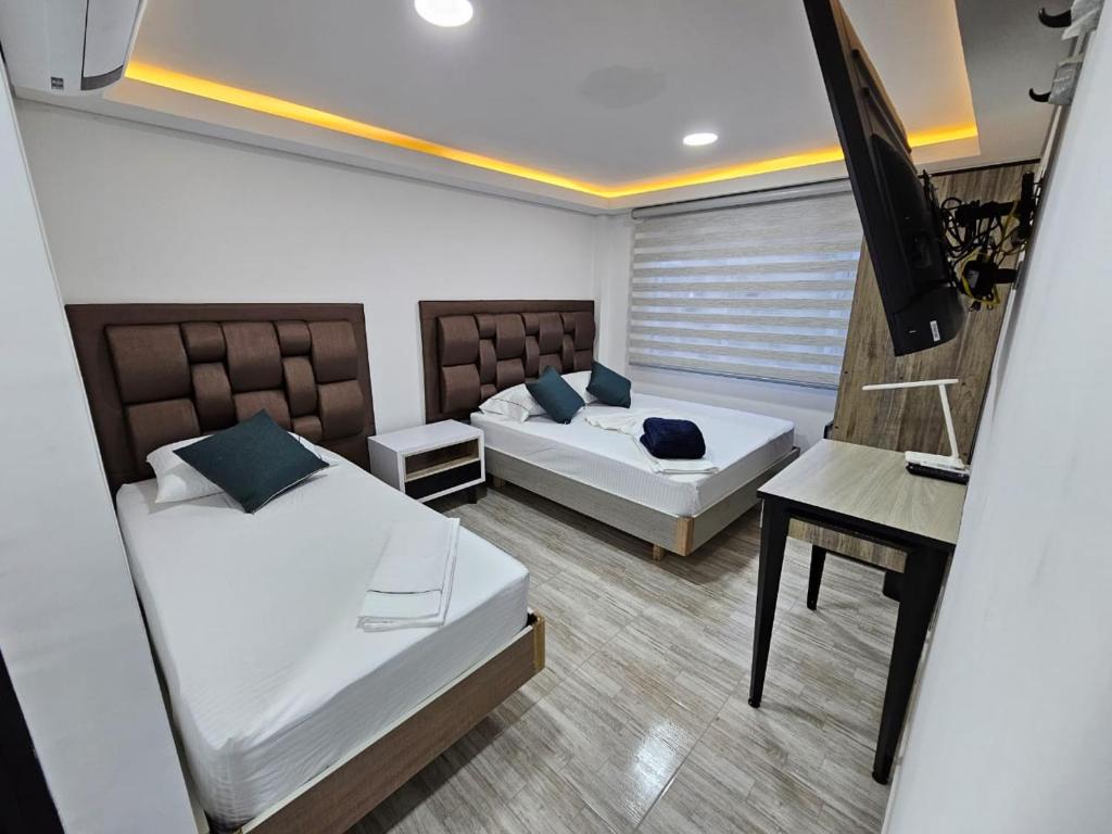 Postel nebo postele na pokoji v ubytování Hostel Boutique Nido de Loros