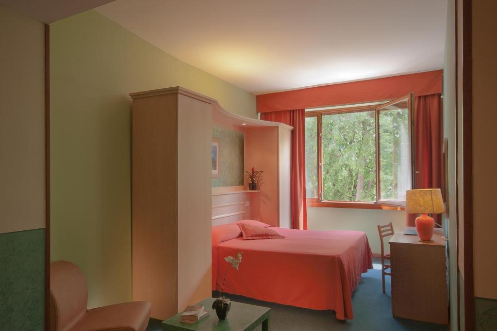 Postel nebo postele na pokoji v ubytování Hotel Meridiana