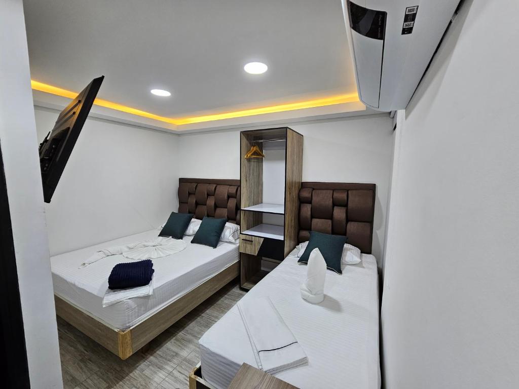 Postel nebo postele na pokoji v ubytování Hostel Boutique Nido de Loros