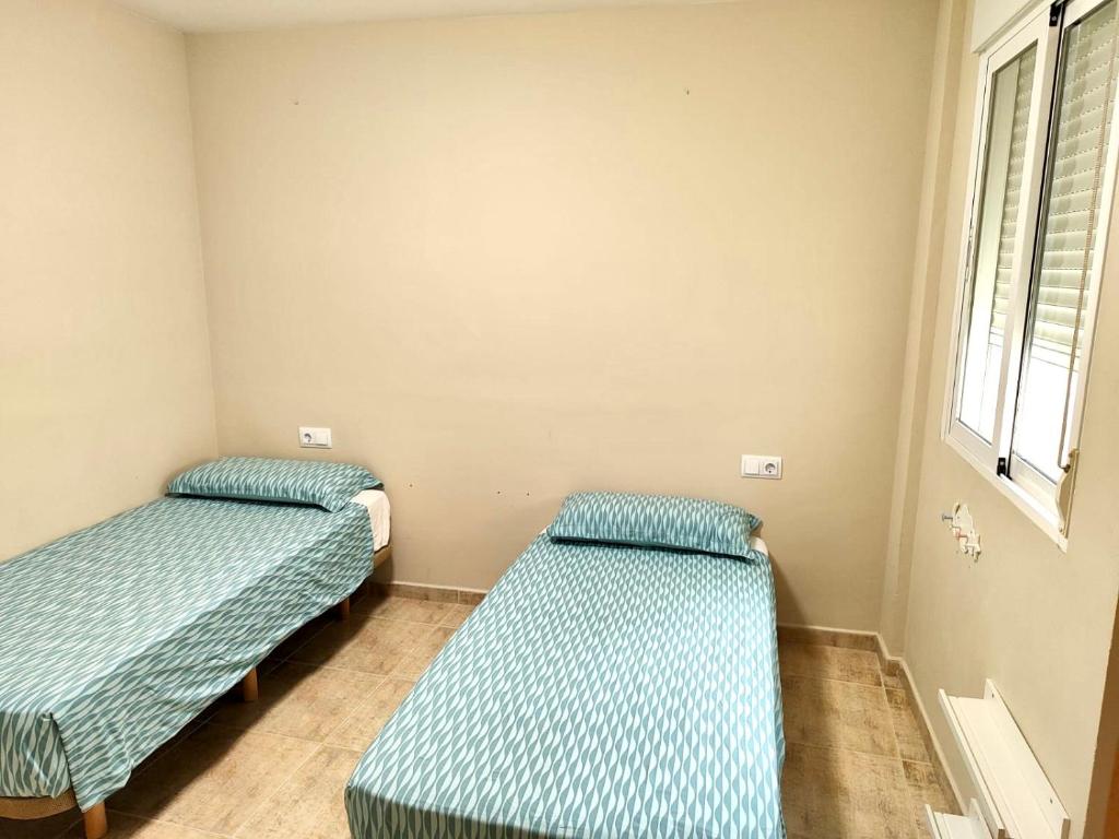 Postel nebo postele na pokoji v ubytování Apartamento Vinaròs (5 min andando del centro)