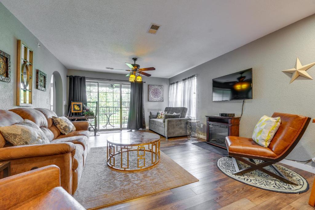 a living room with a couch and a table at Branson Condo Ideally Located 3 Miles to Downtown! in Branson