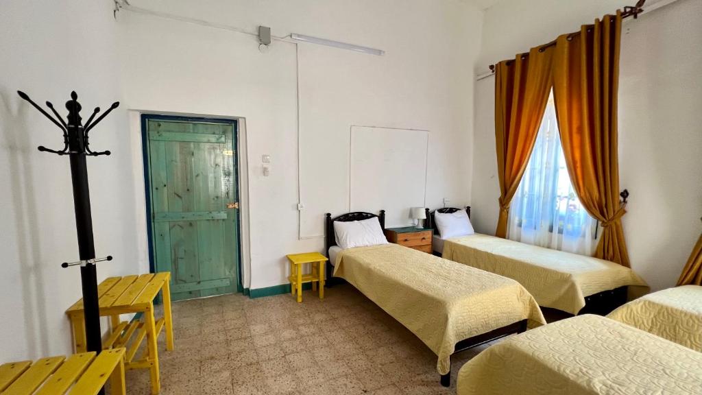 Postel nebo postele na pokoji v ubytování Shazly Inn