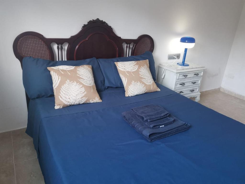Postel nebo postele na pokoji v ubytování CAN TRULLEN CHALET CALAFELL