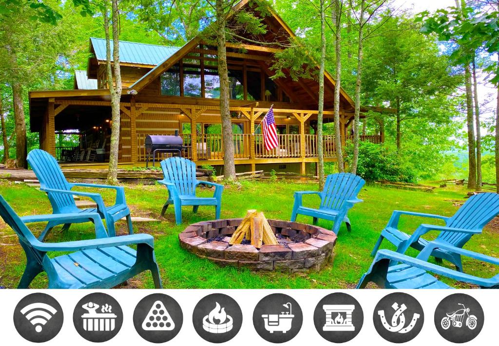 a group of chairs around a fire pit in front of a log cabin at Big Kahuna Lodge cabin in Sevierville