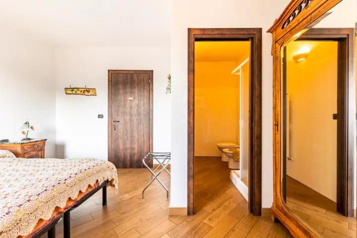A bed or beds in a room at Bed & Breakfast L'erica