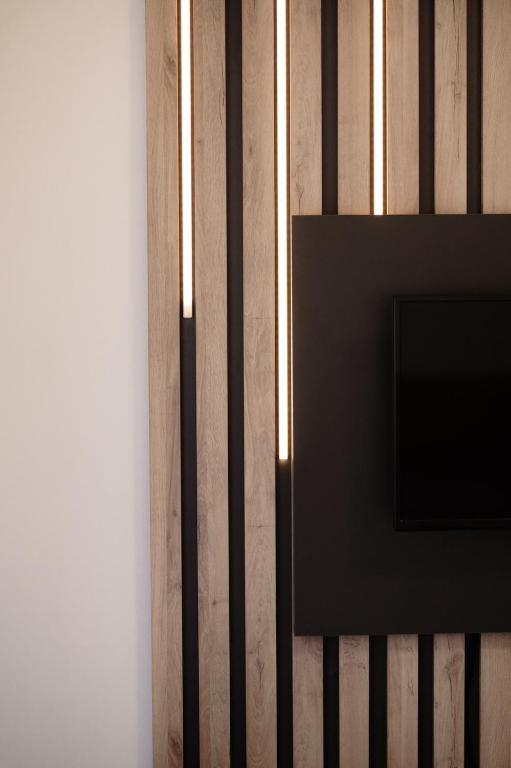 TV o dispositivi per l'intrattenimento presso Apartman Resident