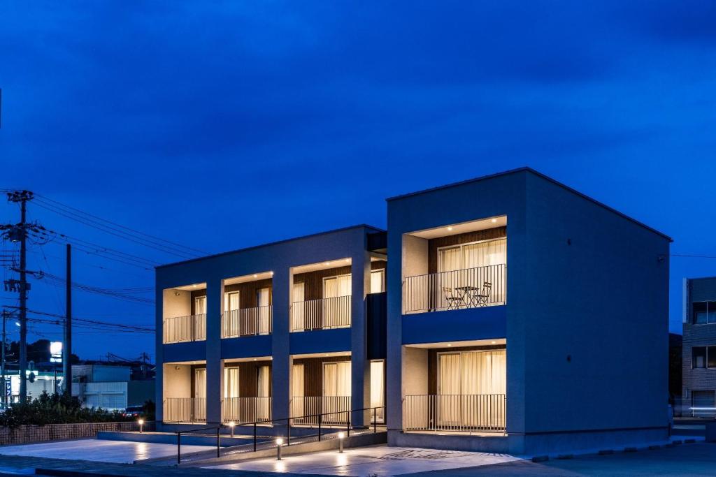 a black building with lights in front of it at Hotel Dios - Vacation STAY 40406v in Awaji