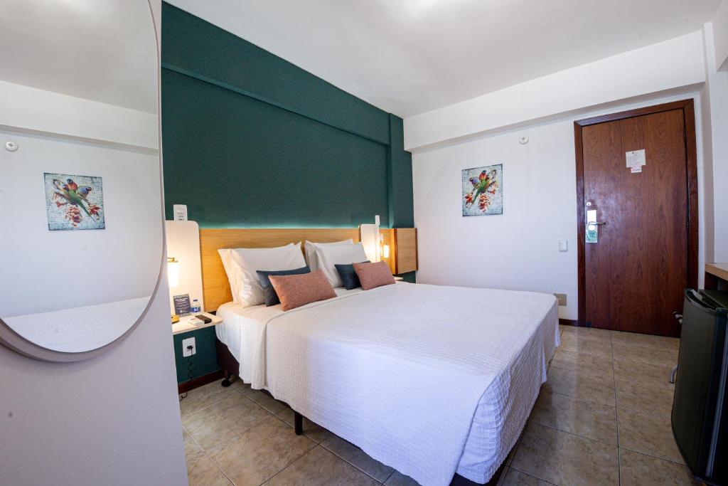 Postel nebo postele na pokoji v ubytování Hotel Verdemar