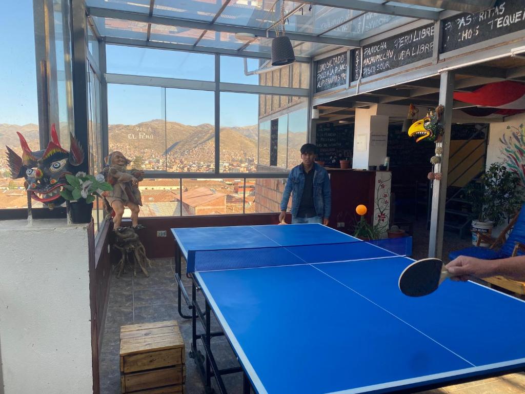 a blue ping pong table in a room with a view at Marvelous Hostel Cusco in Cusco