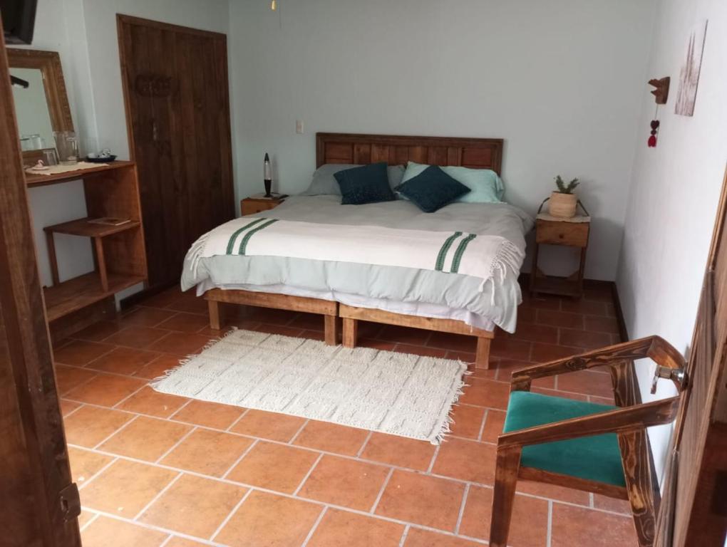 Postel nebo postele na pokoji v ubytování Casa Macetas