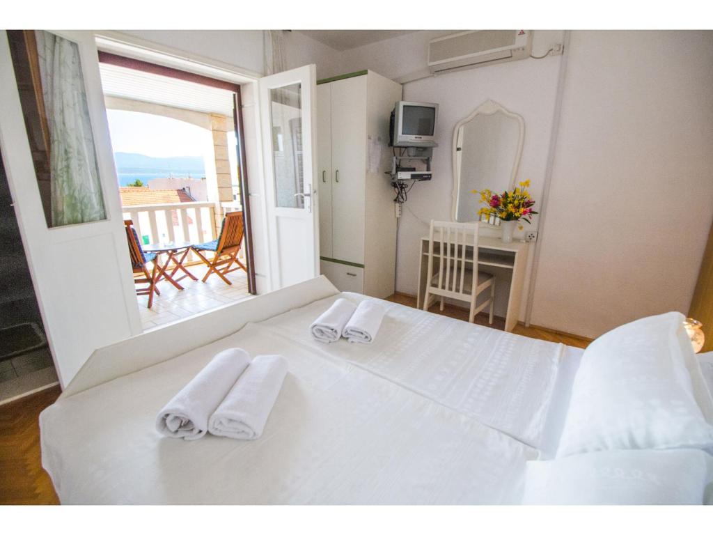 Postel nebo postele na pokoji v ubytování Bol Residence