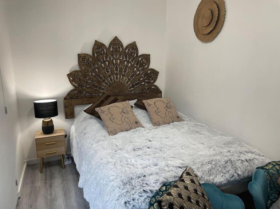 Postel nebo postele na pokoji v ubytování Le Citadin