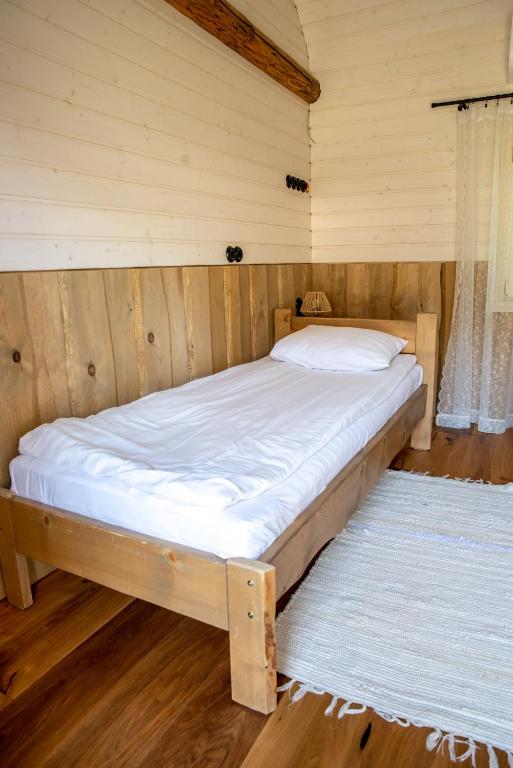 Postel nebo postele na pokoji v ubytování Haanjamehe Taluhotell