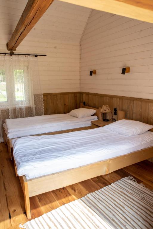 Postel nebo postele na pokoji v ubytování Haanjamehe Taluhotell