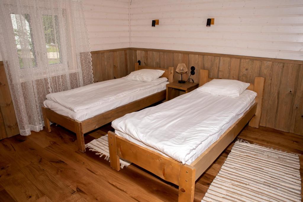 Postel nebo postele na pokoji v ubytování Haanjamehe Taluhotell