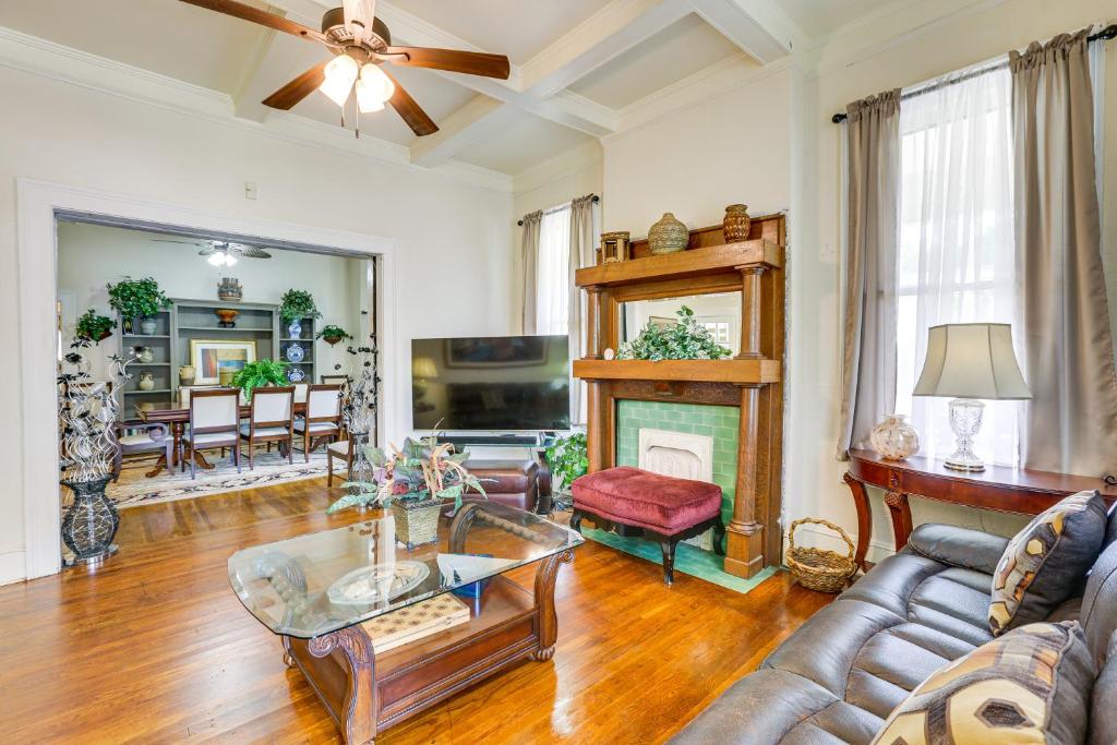 a living room with a couch and a fireplace at Central Albany Home with Covered Porch and Patio! in Albany