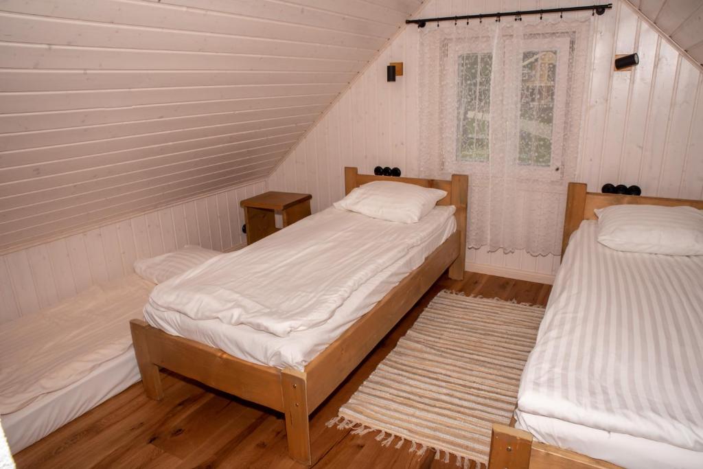 Postel nebo postele na pokoji v ubytování Haanjamehe Taluhotell