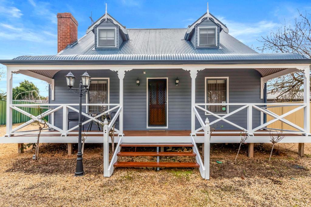 a gray house with a large front porch at Welcoming Ambiant 3BR Abode in Tanunda