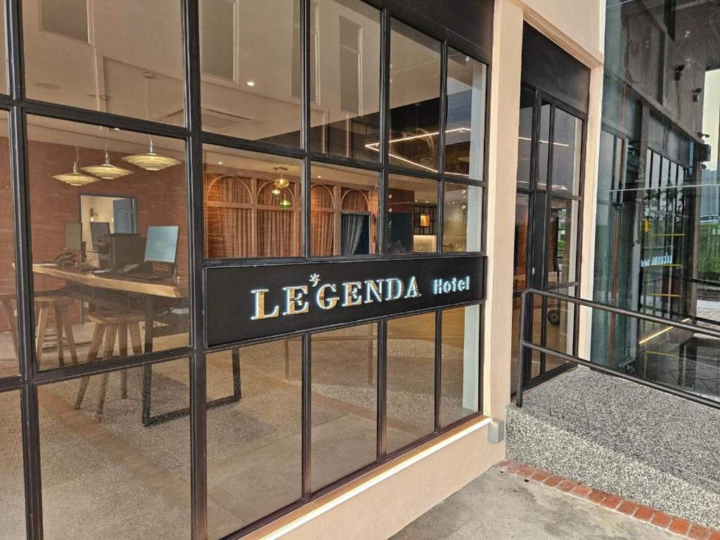 a store window with a sign that reads lelandia had at Le'genda Hotel in Kajang