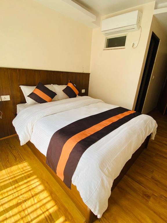 Postel nebo postele na pokoji v ubytování Hotel Abi International