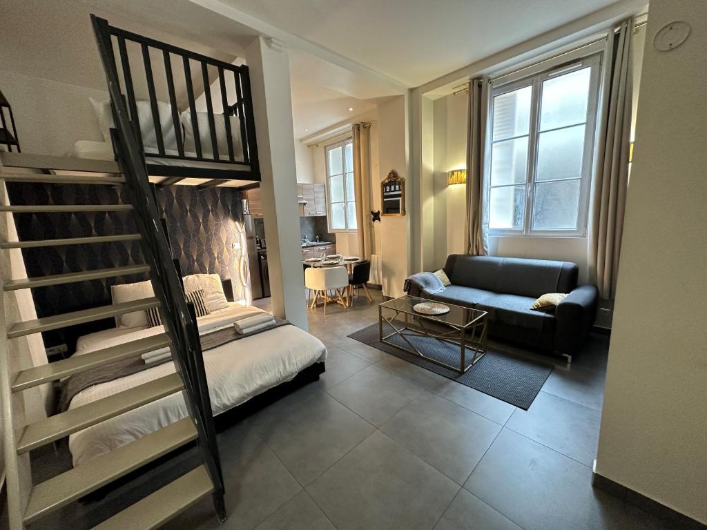 a living room with a bunk bed and a couch at Spacious LOFT near JARDIN du LUXEMBOURG in Paris