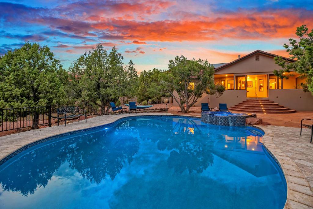 a swimming pool in a yard with a house at Sedona's Paradise Found, Saltwater Pool and Hot Tub, plus CanAm Ride! in Sedona