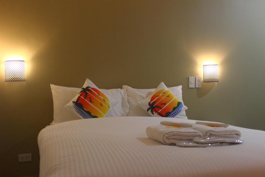 Postel nebo postele na pokoji v ubytování NGN Gran Hotel