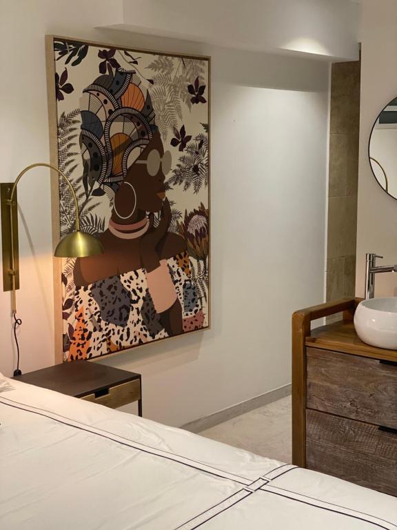 Postel nebo postele na pokoji v ubytování Les Appart villa Sunbay Caraibes avec piscine privative vue mer et montagne