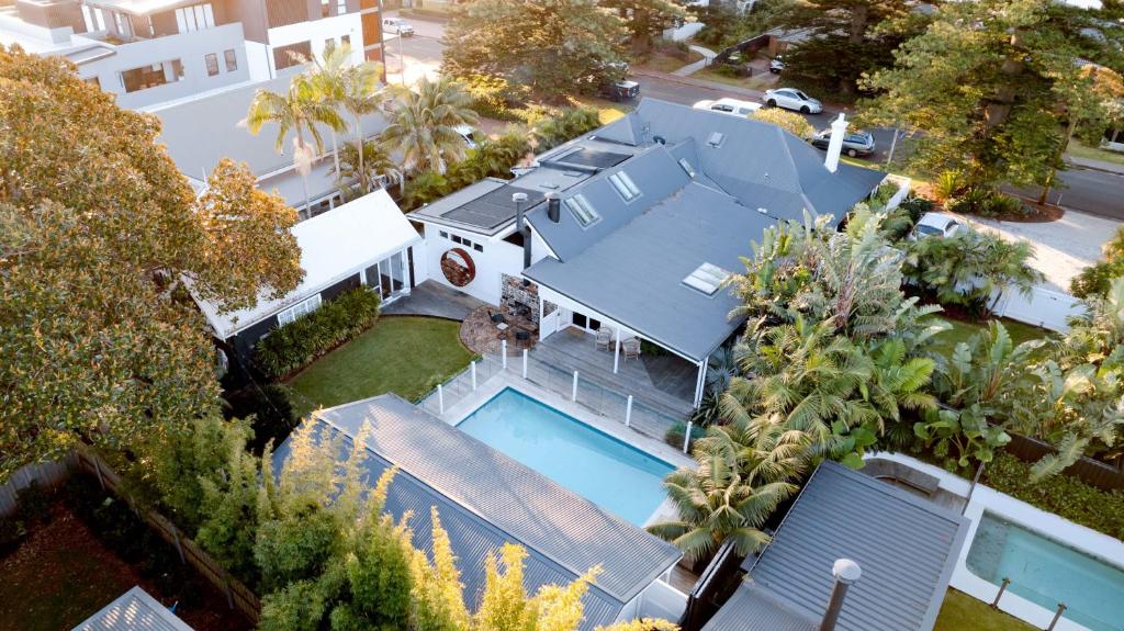 an aerial view of a house with a swimming pool at Soul of Gerringong Farmhouse in Gerringong