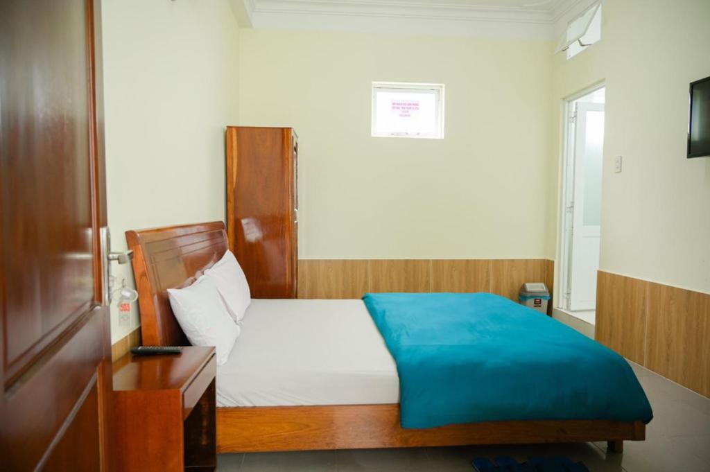 Postel nebo postele na pokoji v ubytování Hân Hoan Hotel