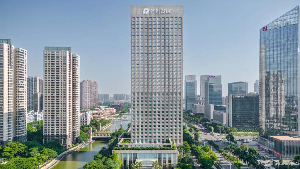 a tall building in the middle of a city at InterContinental Foshan, an IHG Hotel - Free Shuttle Bus for Canton Fair in Foshan