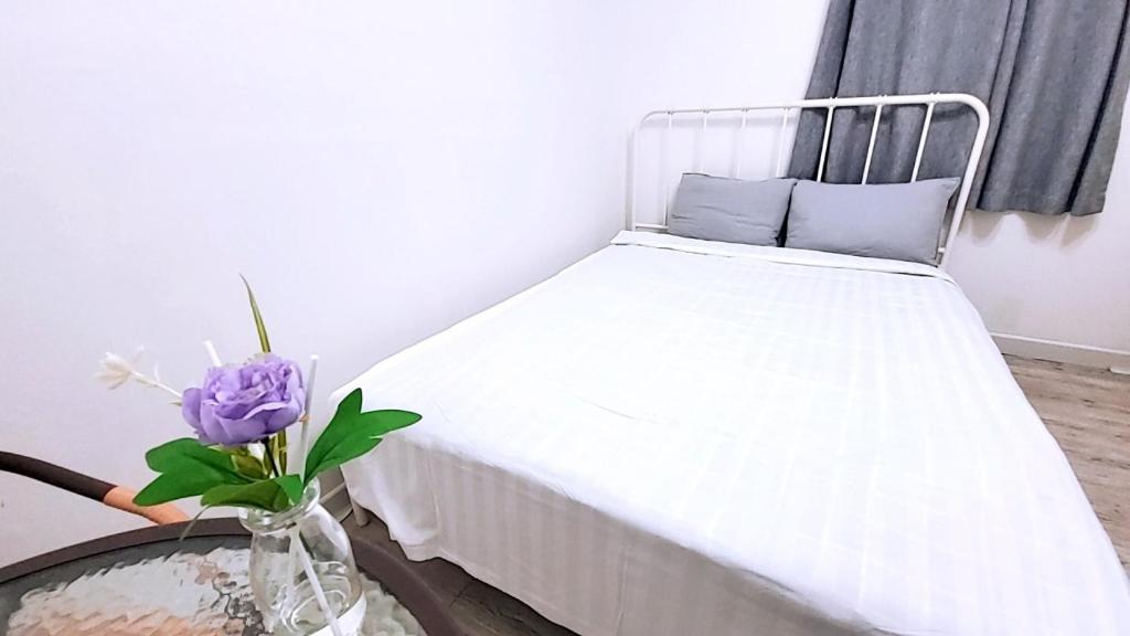 Postel nebo postele na pokoji v ubytování PyoLi Guesthouse