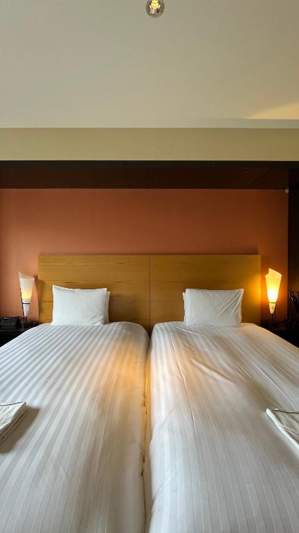 Postel nebo postele na pokoji v ubytování KOKO HOTEL Premier Kanazawa Korinbo