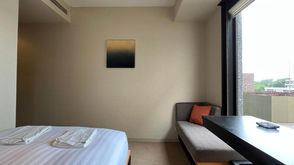 Postel nebo postele na pokoji v ubytování KOKO HOTEL Premier Kanazawa Korinbo