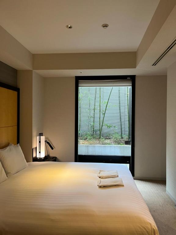 Postel nebo postele na pokoji v ubytování KOKO HOTEL Premier Kanazawa Korinbo