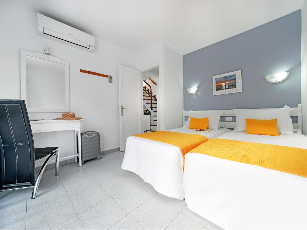 Posteľ alebo postele v izbe v ubytovaní Bungalows Vistaflor