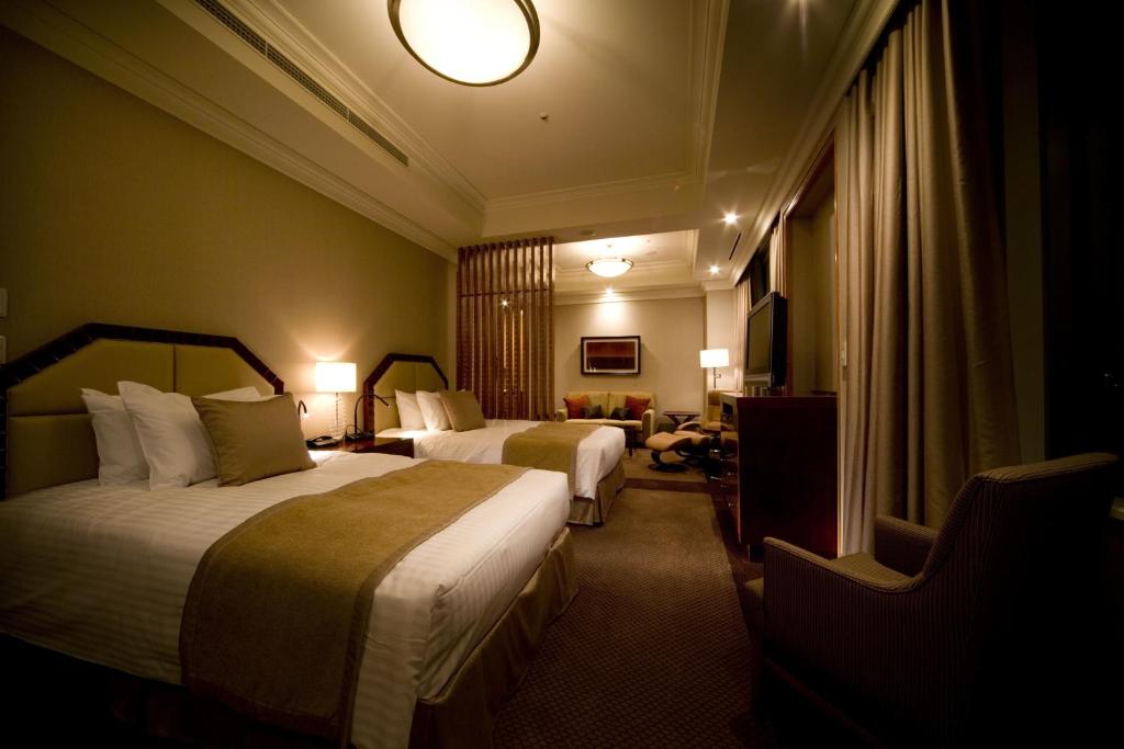 Postel nebo postele na pokoji v ubytování Imperial Hotel Osaka