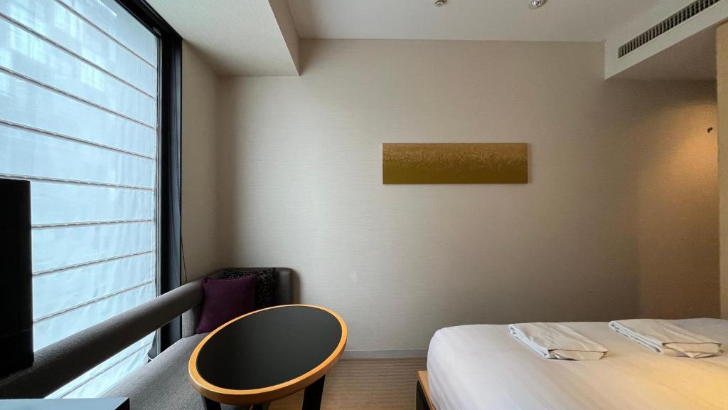 Postel nebo postele na pokoji v ubytování KOKO HOTEL Premier Kanazawa Korinbo