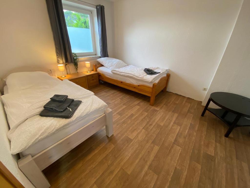 Postel nebo postele na pokoji v ubytování Großes Monteurhaus in Emden
