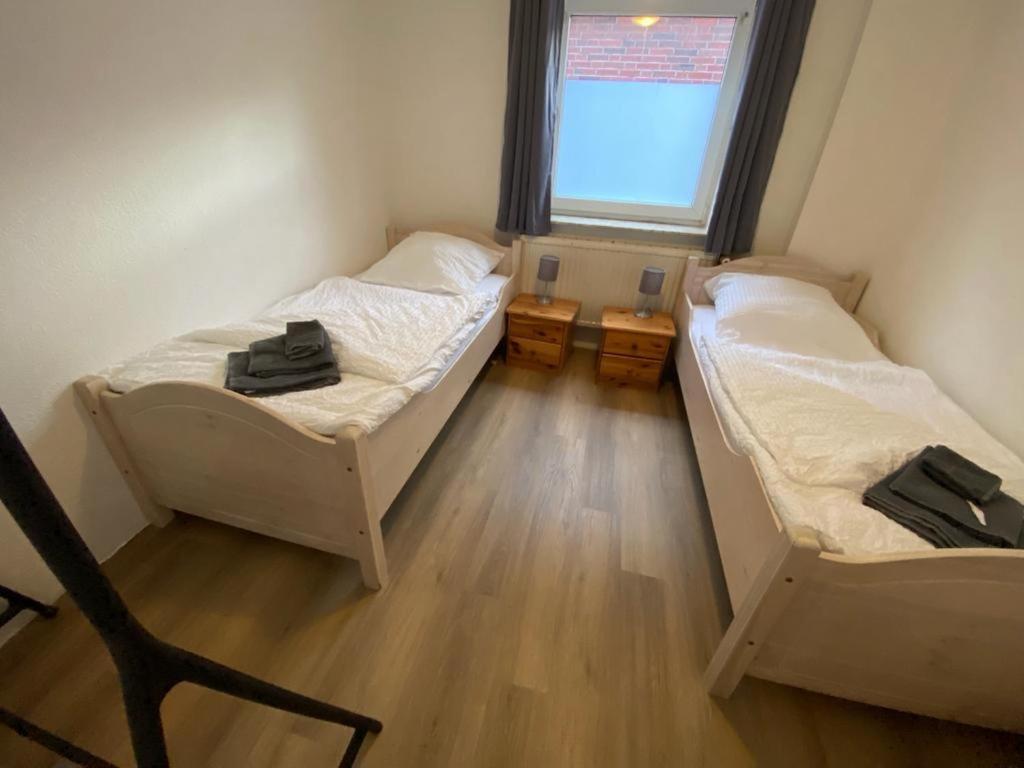 Postel nebo postele na pokoji v ubytování Großes Monteurhaus in Emden