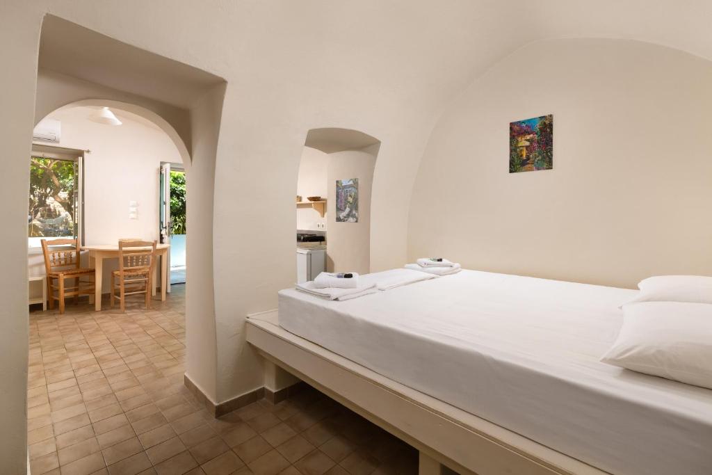 Postel nebo postele na pokoji v ubytování Aria di Rodi