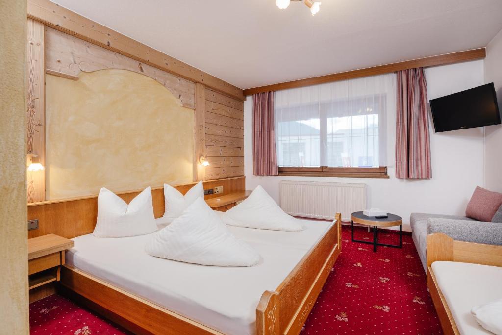 Postel nebo postele na pokoji v ubytování Hotel Andrea