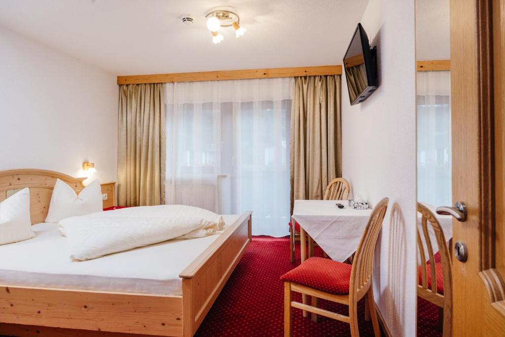 Postel nebo postele na pokoji v ubytování Hotel Andrea