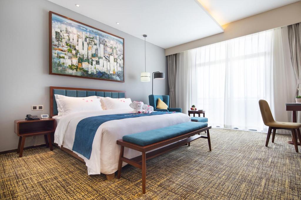 Кровать или кровати в номере Ausotel Smart Baiyun International Airport T2