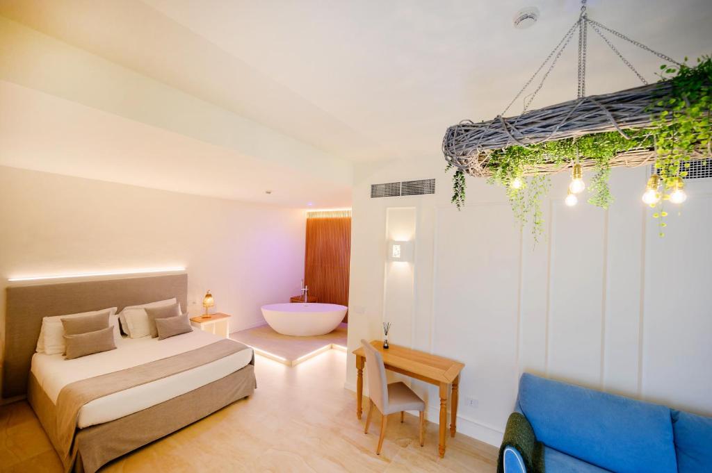 Postel nebo postele na pokoji v ubytování Regiohotel Manfredi