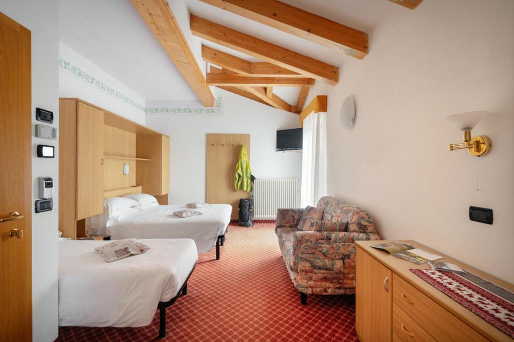 Łóżko lub łóżka w pokoju w obiekcie Hotel Villa Emma