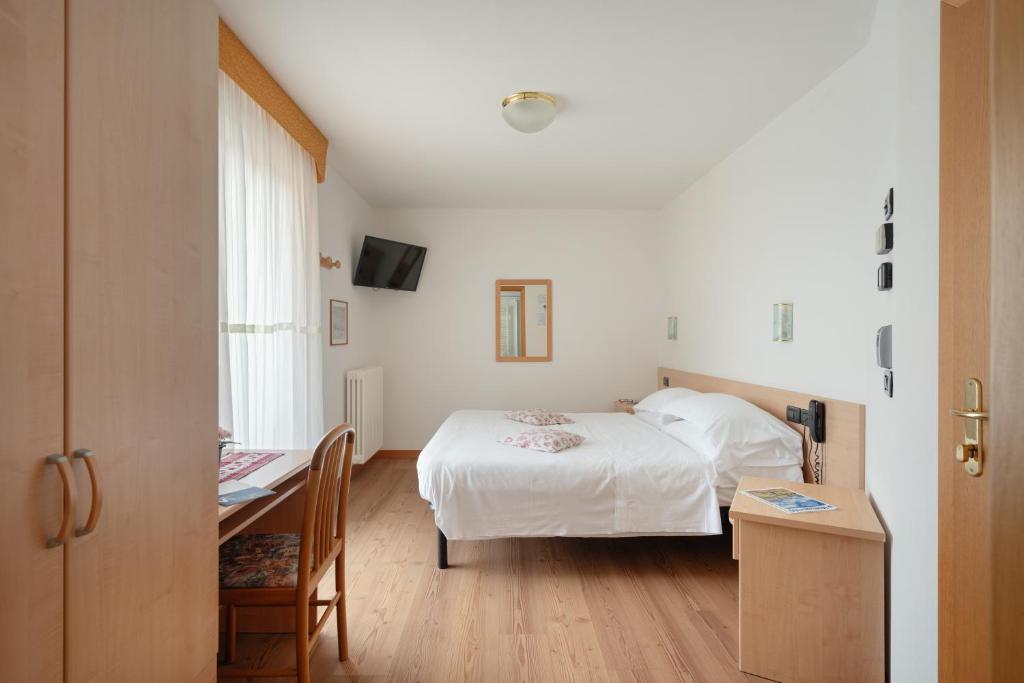 Łóżko lub łóżka w pokoju w obiekcie Hotel Villa Emma