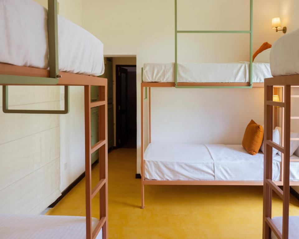 Postel nebo postele na pokoji v ubytování Samba Ahangama