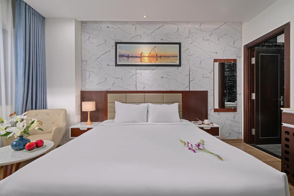 Postel nebo postele na pokoji v ubytování Aria Grand Hotel & Spa