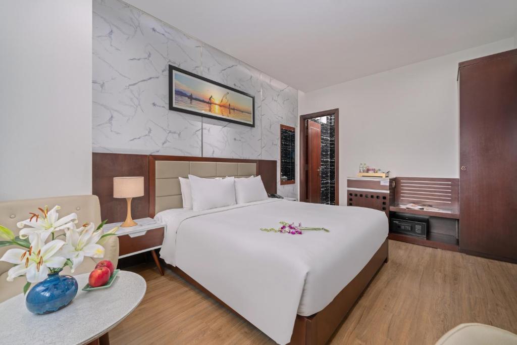 Postel nebo postele na pokoji v ubytování Aria Grand Hotel & Spa